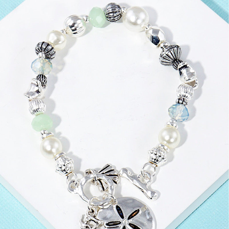 Silver Sand Dollar Charm Bracelet  Trendy Wholesale   